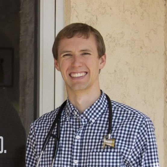 Dr. Kohl smiling outside office